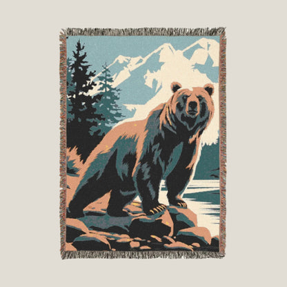 River Grizzly Bear Woven Throw Blanket with a bear standing by a river in a natural landscape. Cozy and durable outdoor blanket for wildlife enthusiasts.