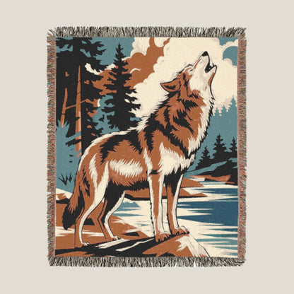 Wolf Howling Woven Throw Blanket with a wolf howling at the moon in a wilderness setting. Perfect cozy blanket for outdoor lovers and wilderness explorers.